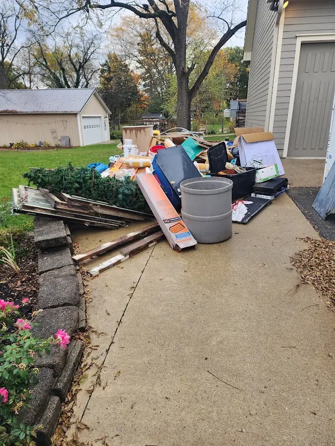 Dumpster being loaded with debris for Commercial Dumpster Rental in North Canton